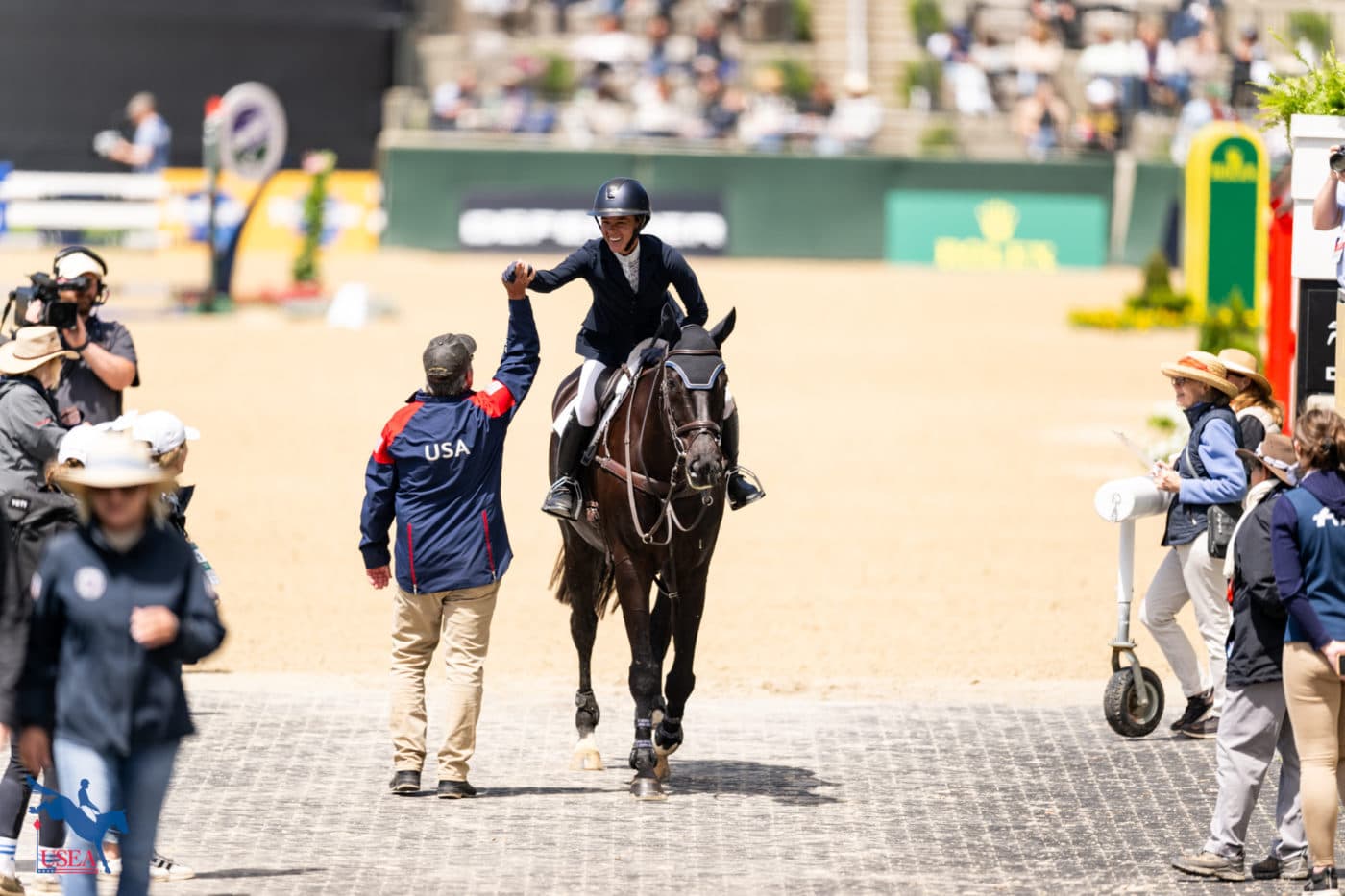David O'Connor gave Mia Farley a big high five after her show jumping round with Invictus. USEA/Atalya Boytner photo